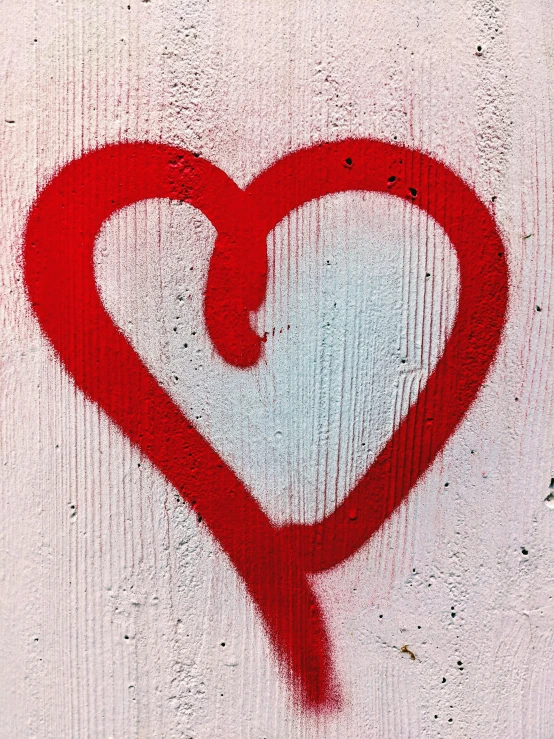 a drawing on concrete of a heart