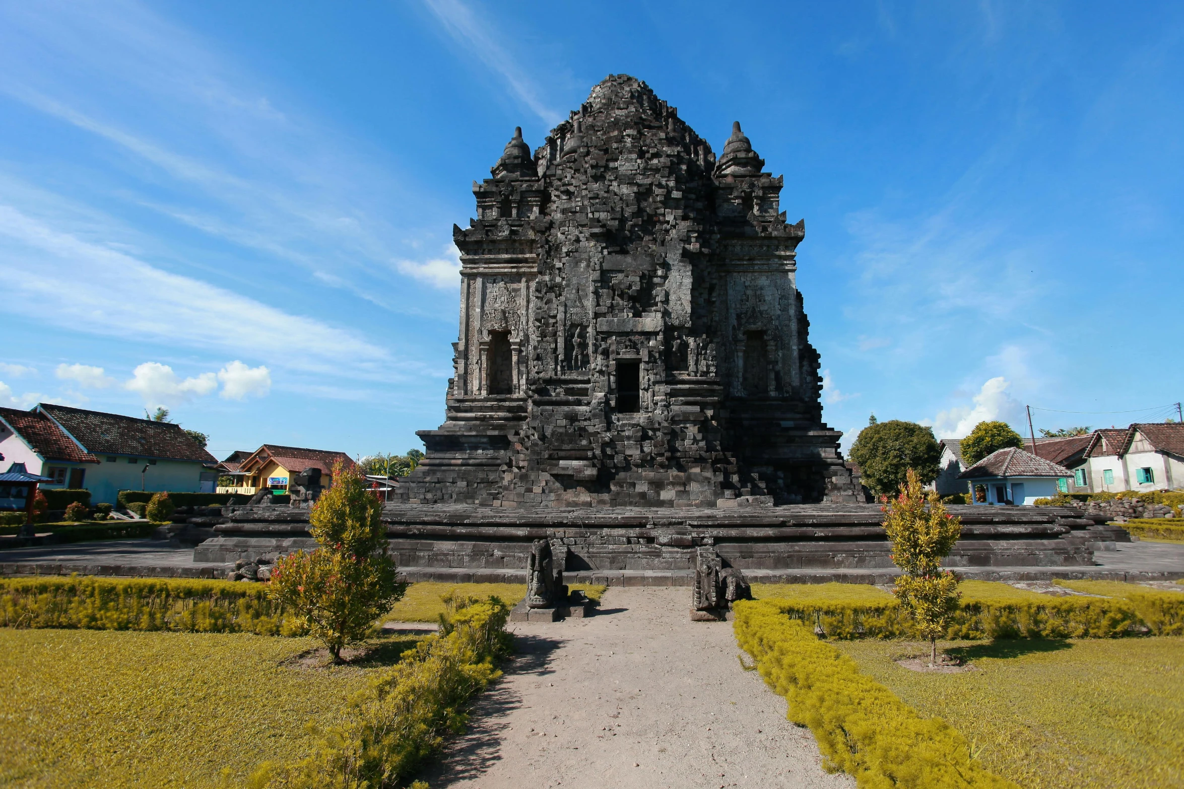 the tower of the temple stands over an entranceway