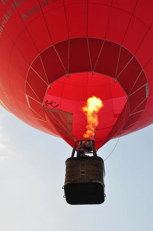 a red  air balloon is lit up in the sky