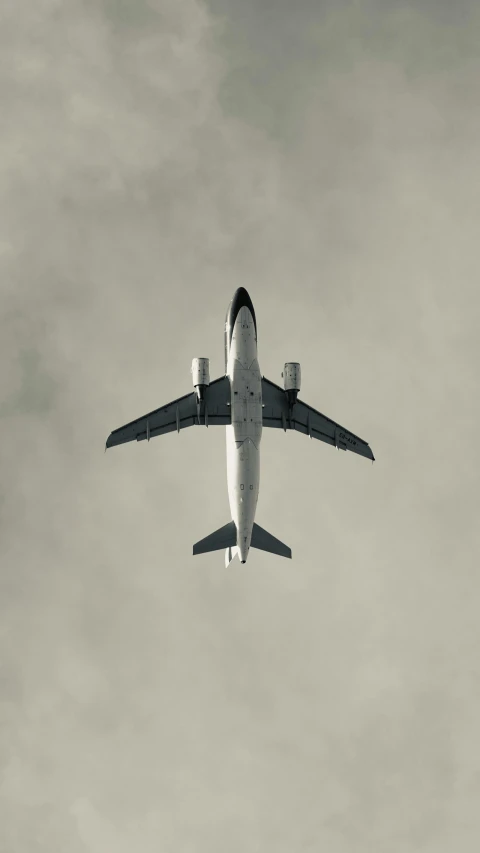 an airplane with a landing gear down flying through the air