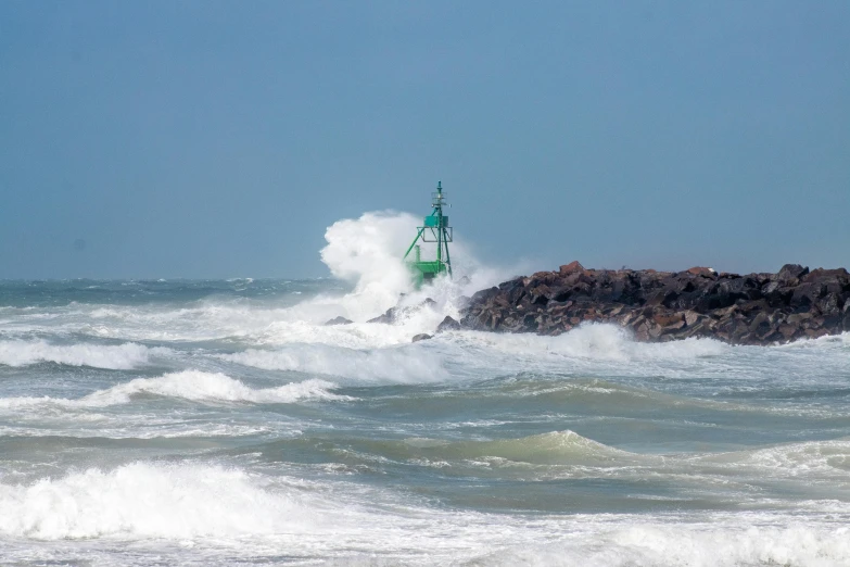 the boat is in rough choppy waters on the coast