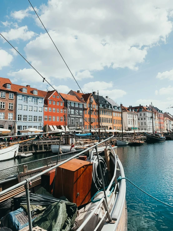 a city with water, a harbor and small boats