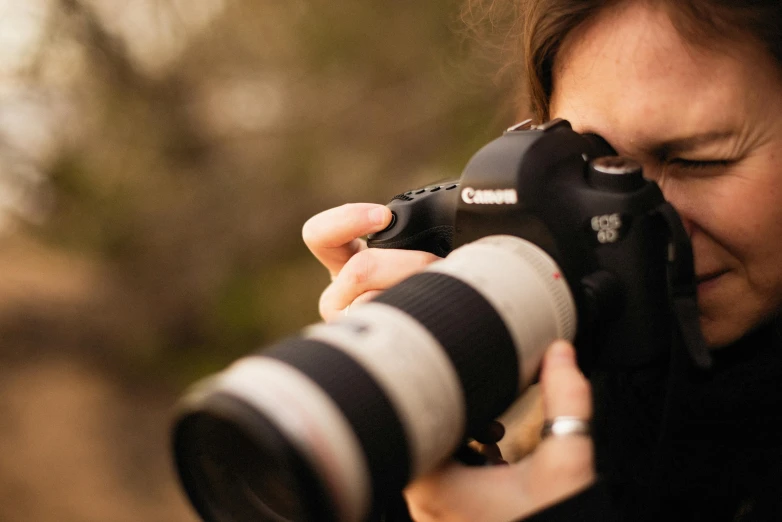 woman taking a pograph with a large camera