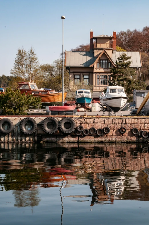 a house that has boats in the water near it