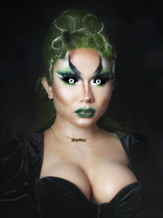 a woman with green hair and make up wearing makeup