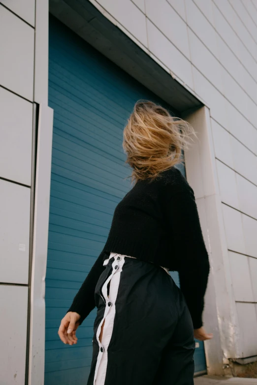 a women who is standing near the door