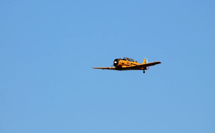 a small airplane is flying in a clear sky