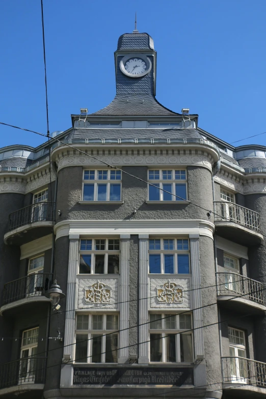 this is a very old style building with an intricate tower and clock