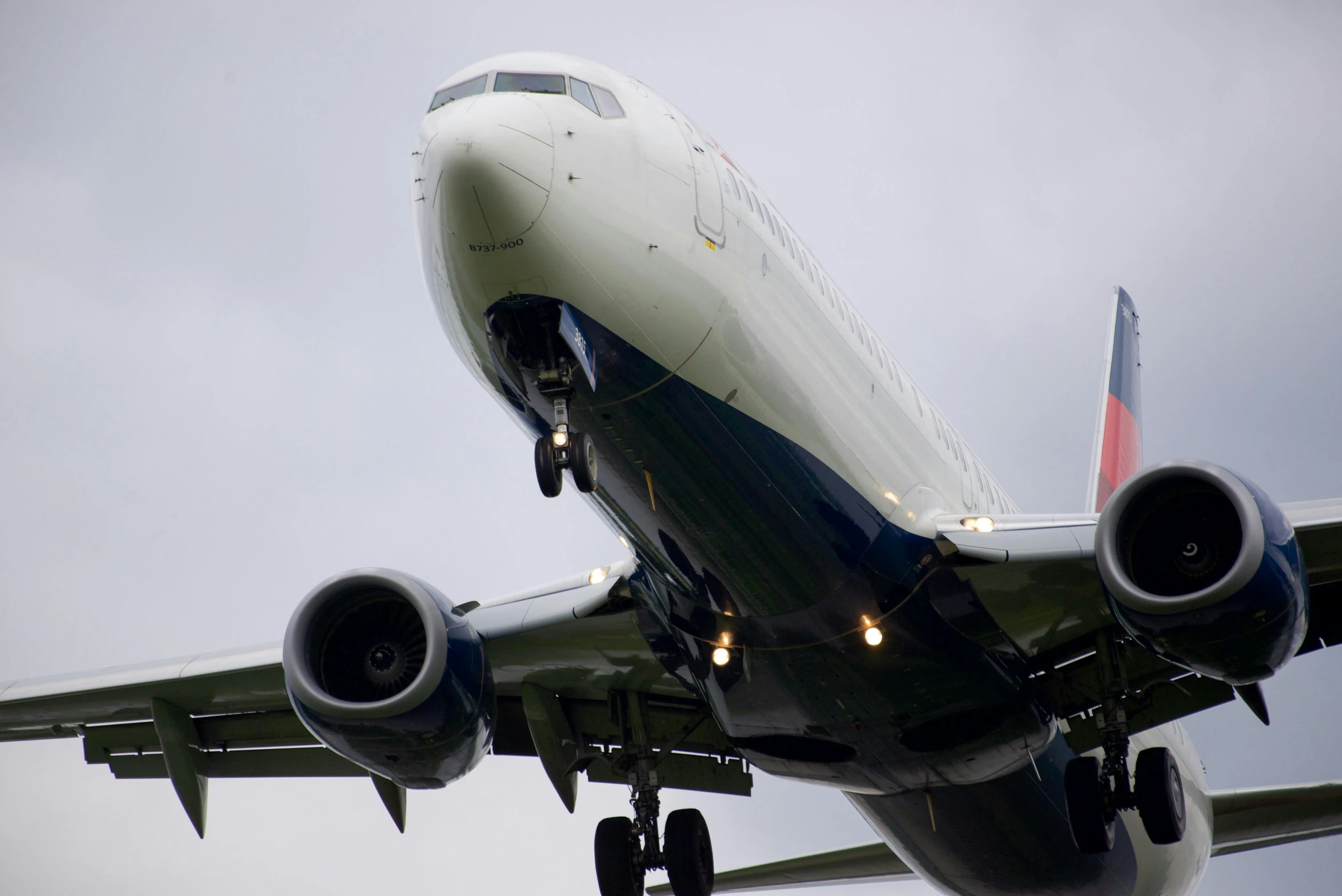 an airplane with one leg up on a landing strip