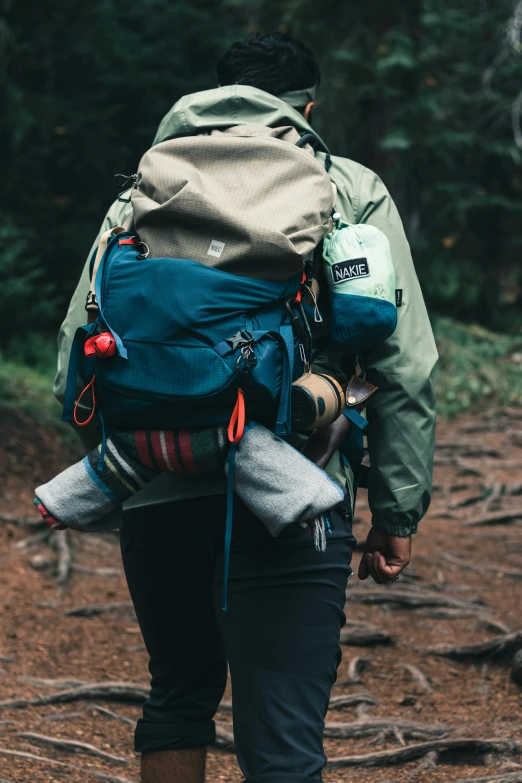 the back of a person walking in the woods