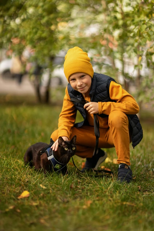 a child and a small dog are posing for a picture