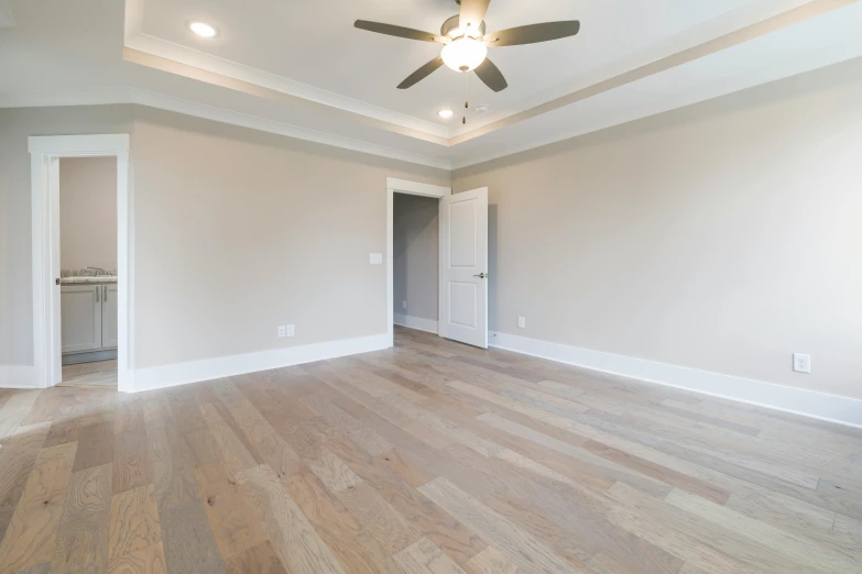 a very big room with some nice wood flooring