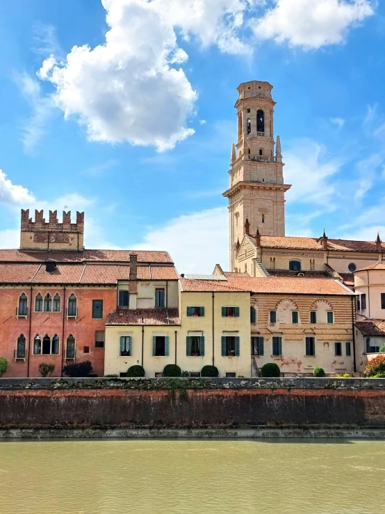 a very tall clock tower towering over the city