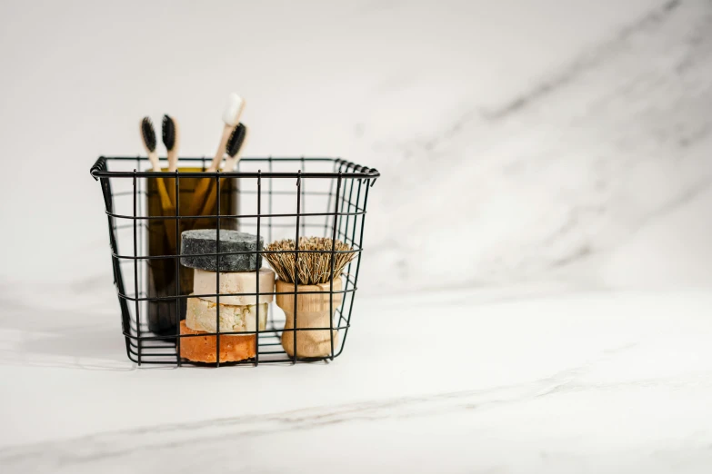 a basket filled with bottles and other items in the snow