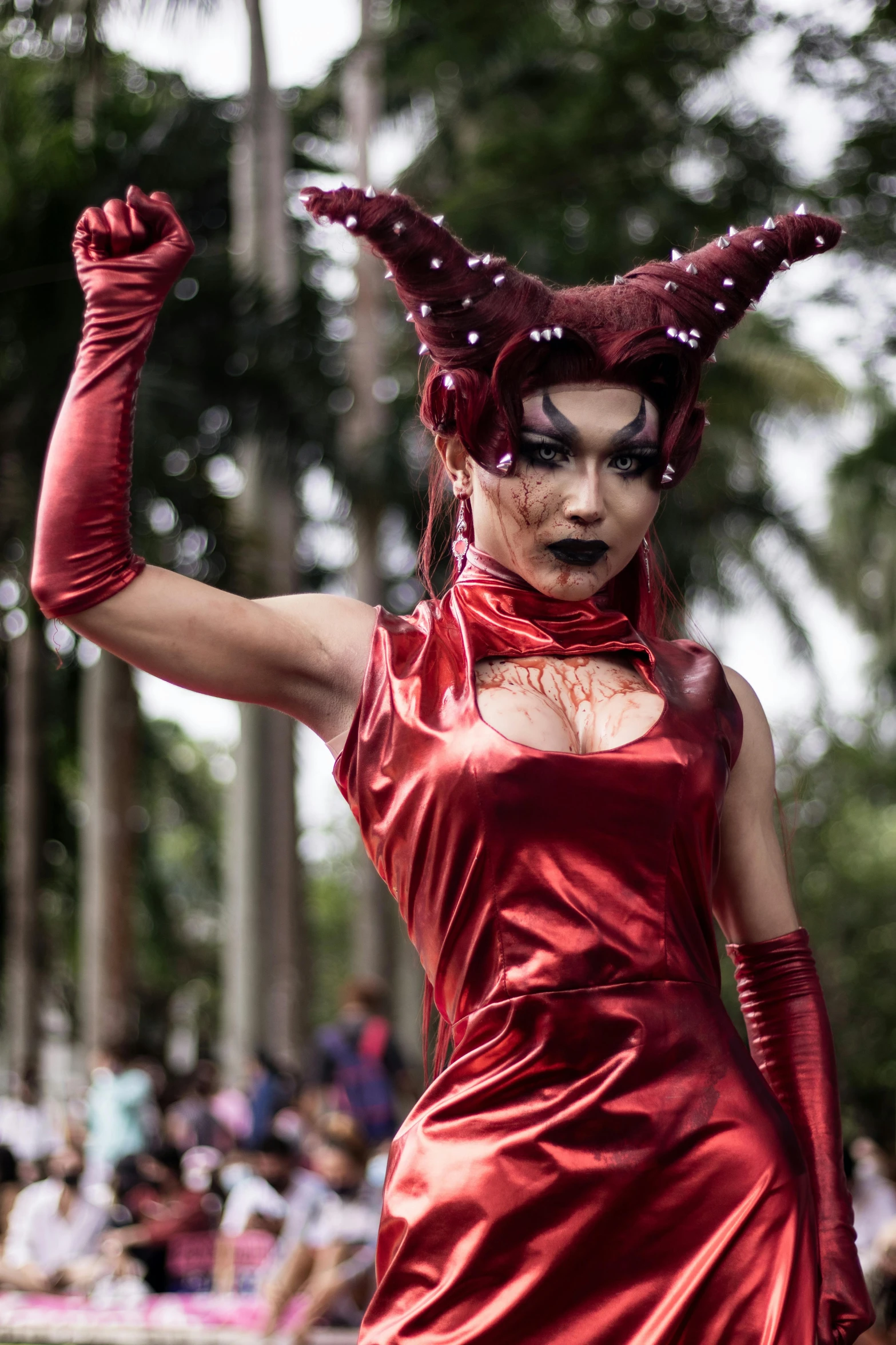 a person wearing a red costume and horns