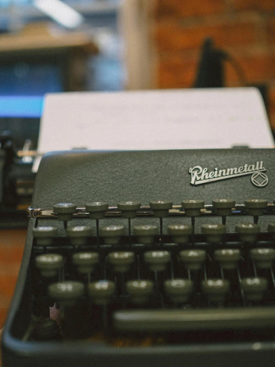 an old fashioned typewriter is sitting on a table