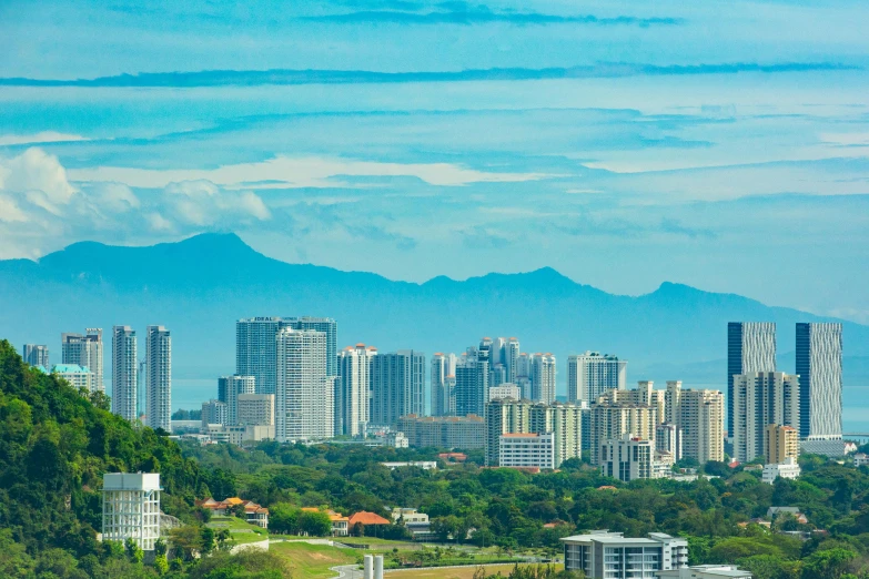 a large city view from the peak of a hill