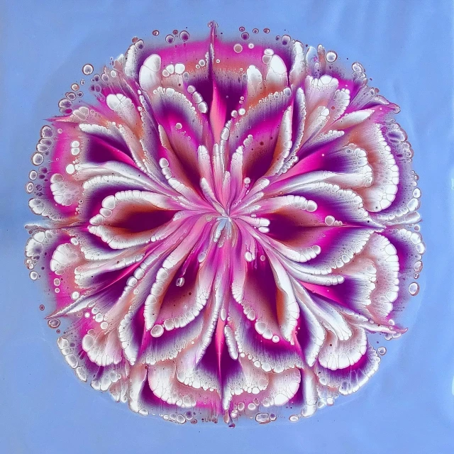 a circular painting with water droplets on it