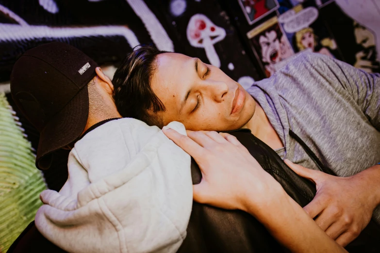 a man is sleeping in a chair while wearing a black hat