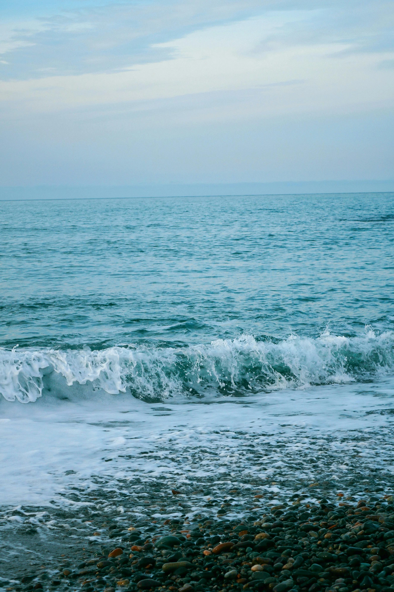 an empty beach is shown with lots of water