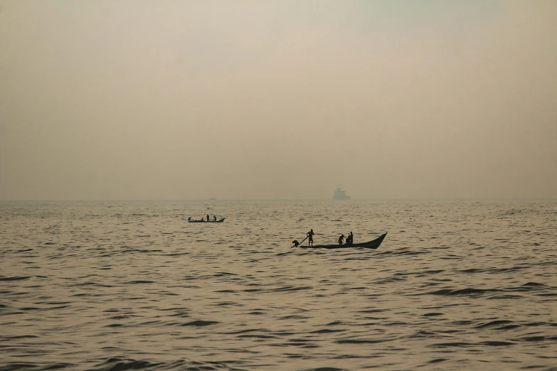 two men in small boat in open water