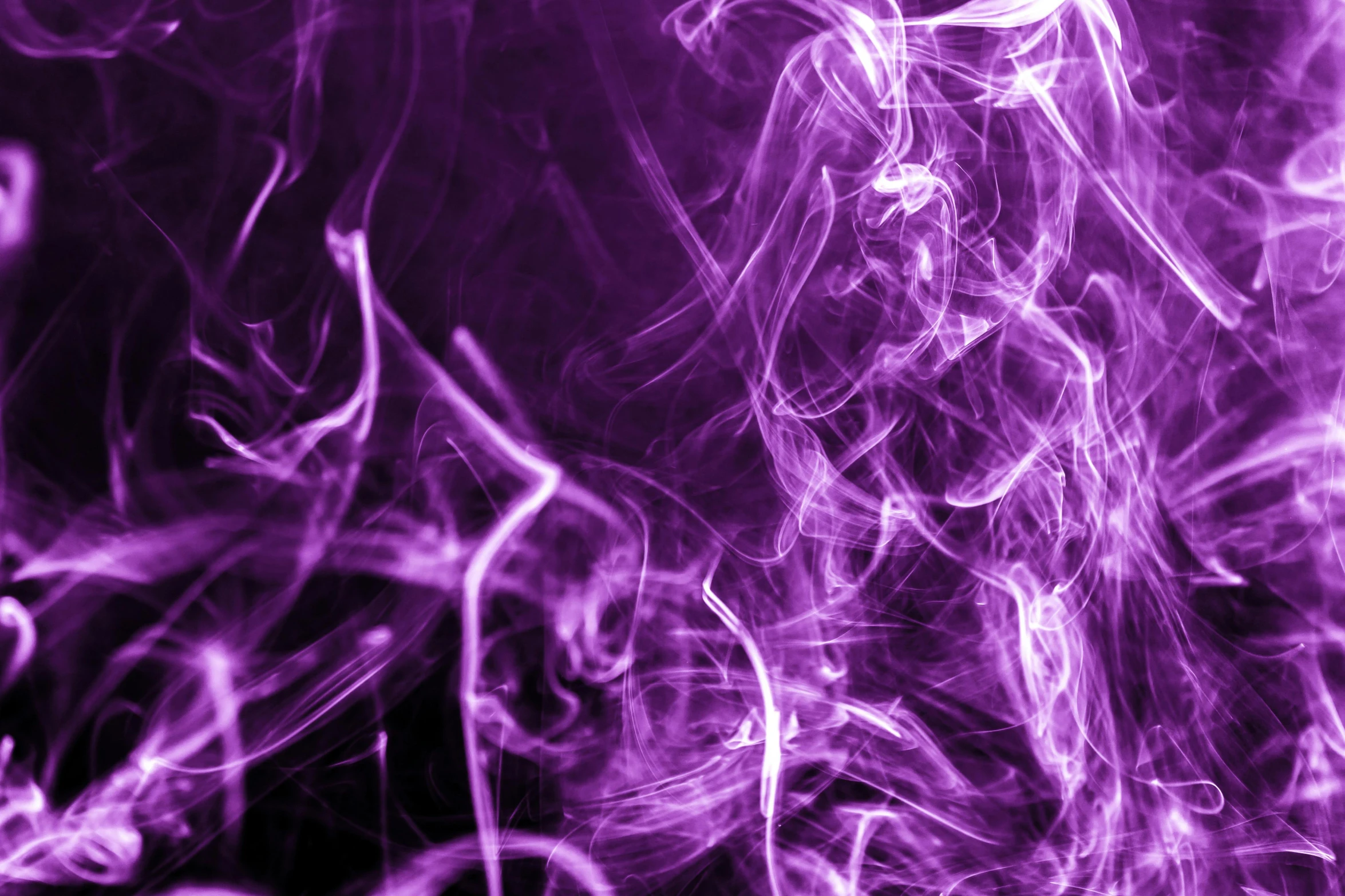 purple smoke rising over a black background