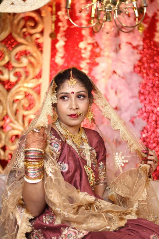 a woman in an indian wedding outfit