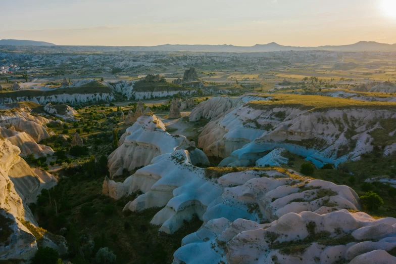 sunset lights up the landscape of a rocky canyon