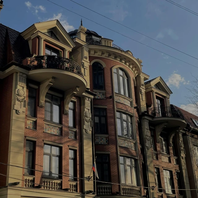 an old brick building with a balcony and balcony balconies