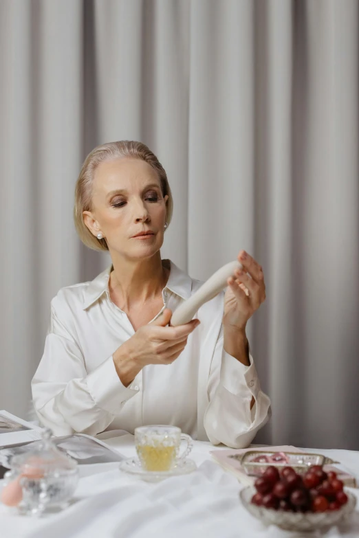 a woman that is sitting at a table