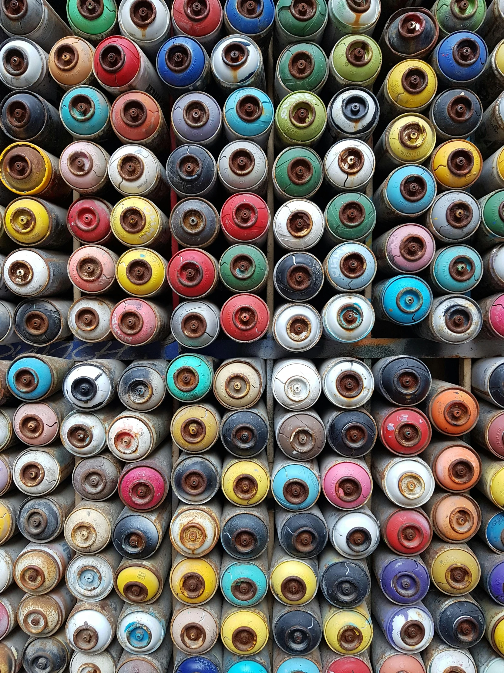 various type of multi - colored spools lined up in rows