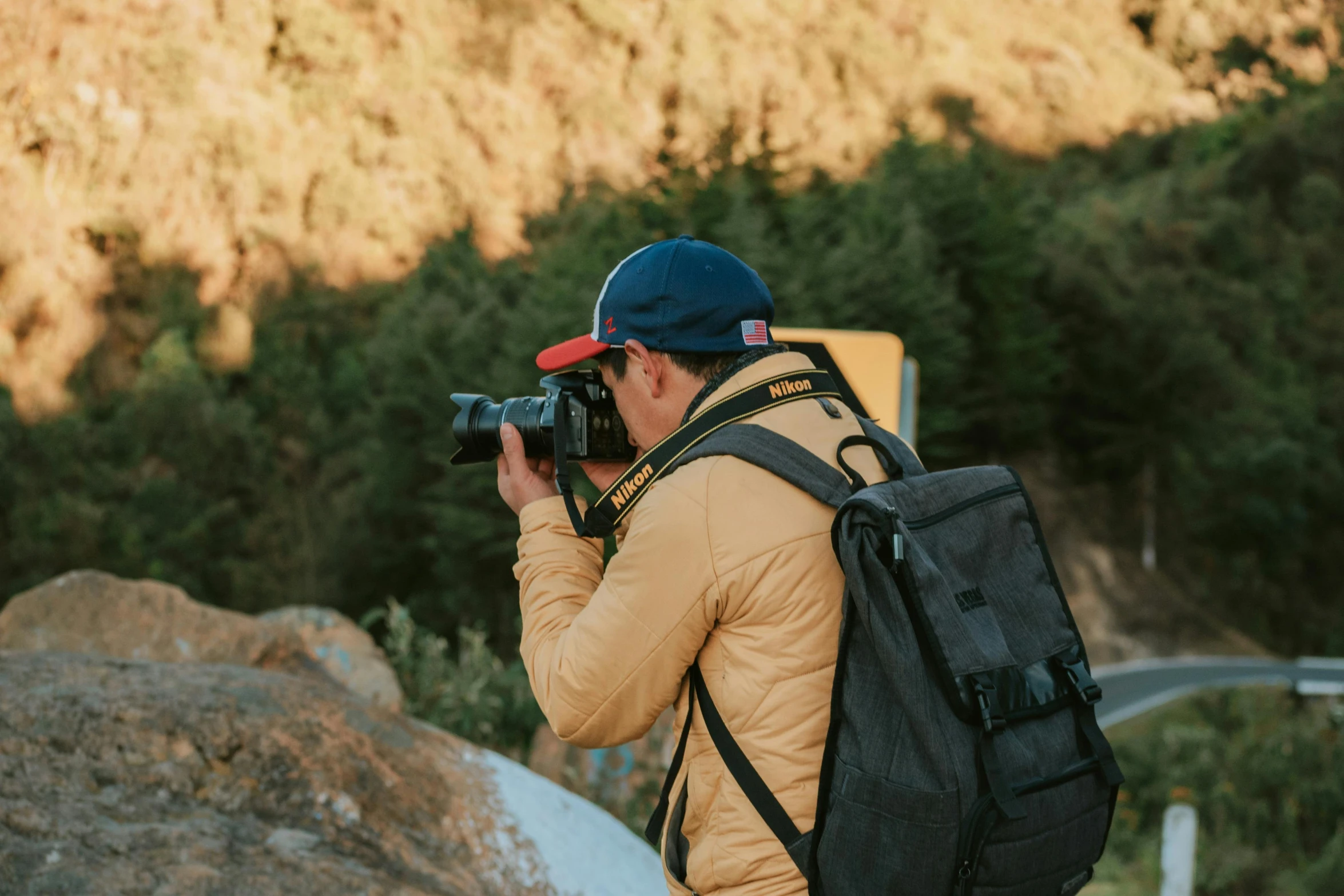 a man that is standing up with a backpack