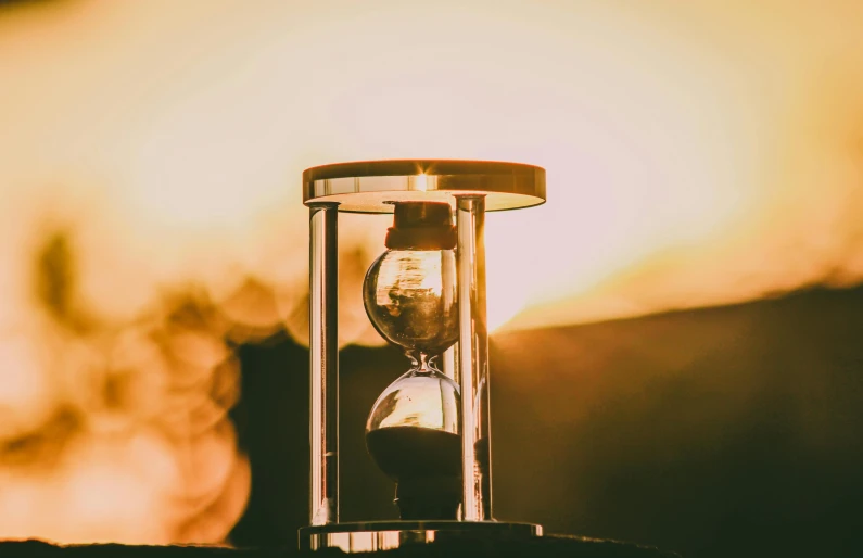 a hourglass with the light glowing from inside