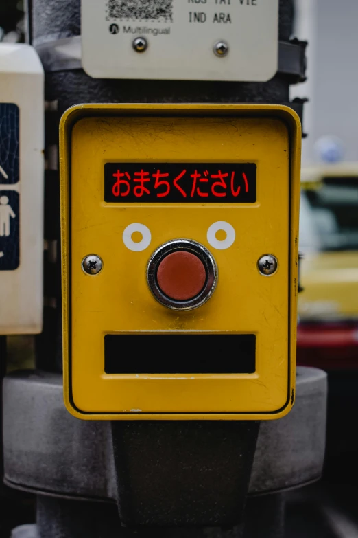 a close up of a yellow object on a pole