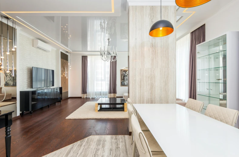 a clean and organized living room with wood floors