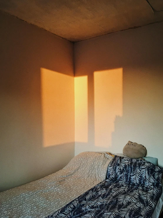 this is a bed with an image of a light shining through the window