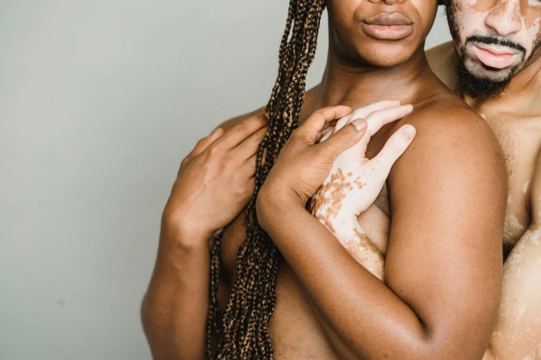 a black man and woman with their faces painted