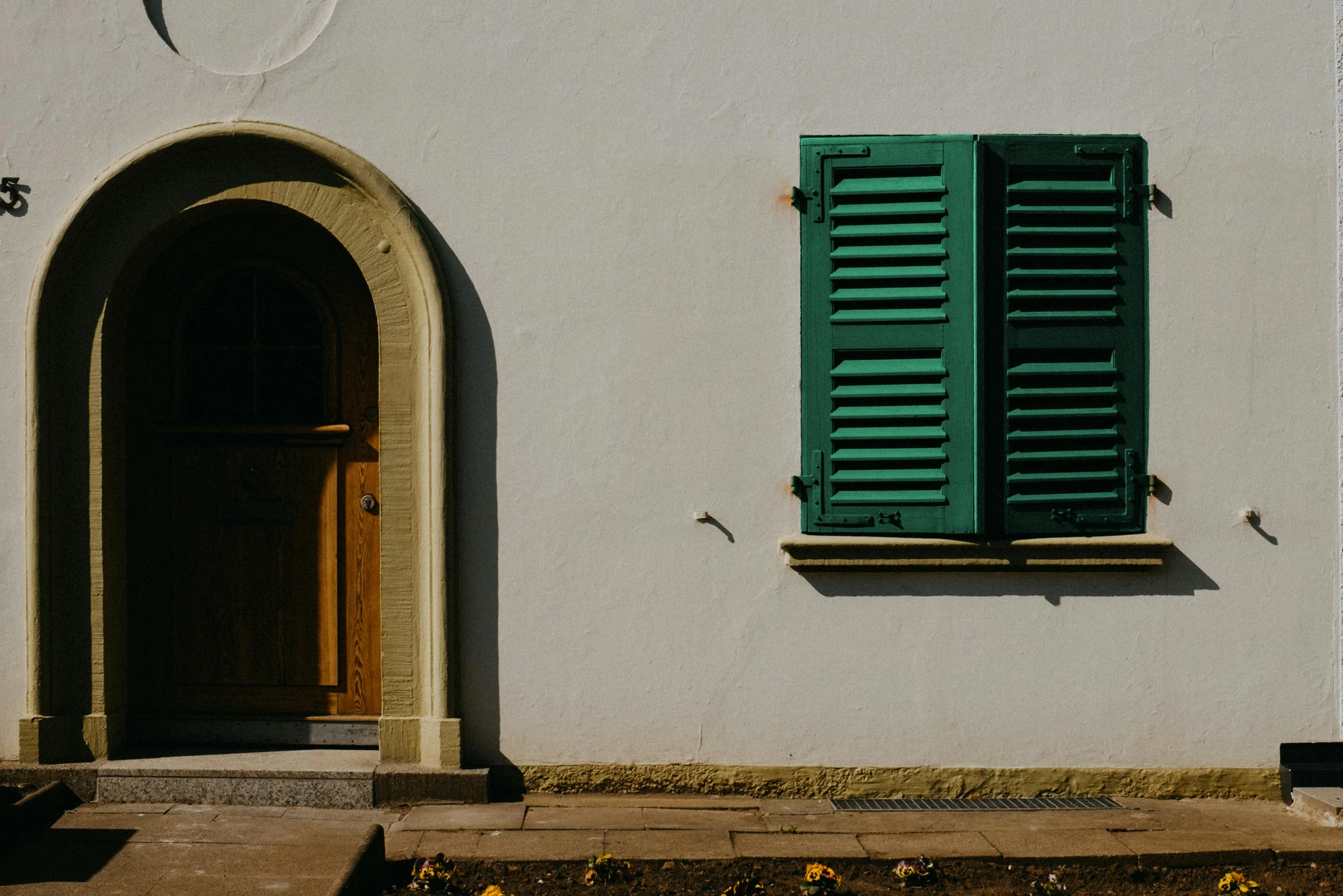 this is a door on a white stucco building