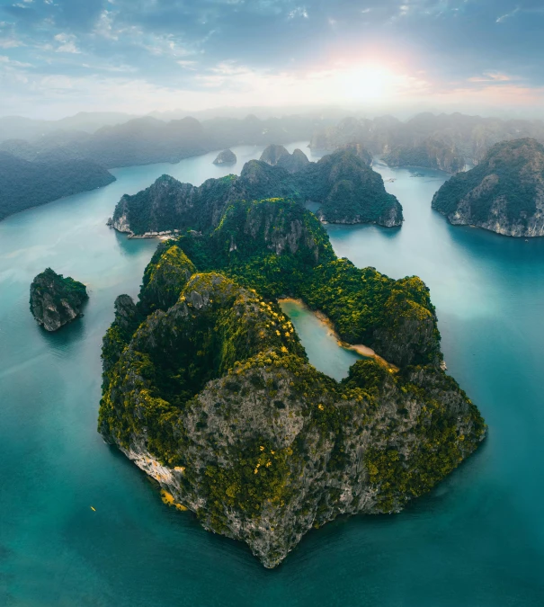 a boat traveling through the ocean near land and water