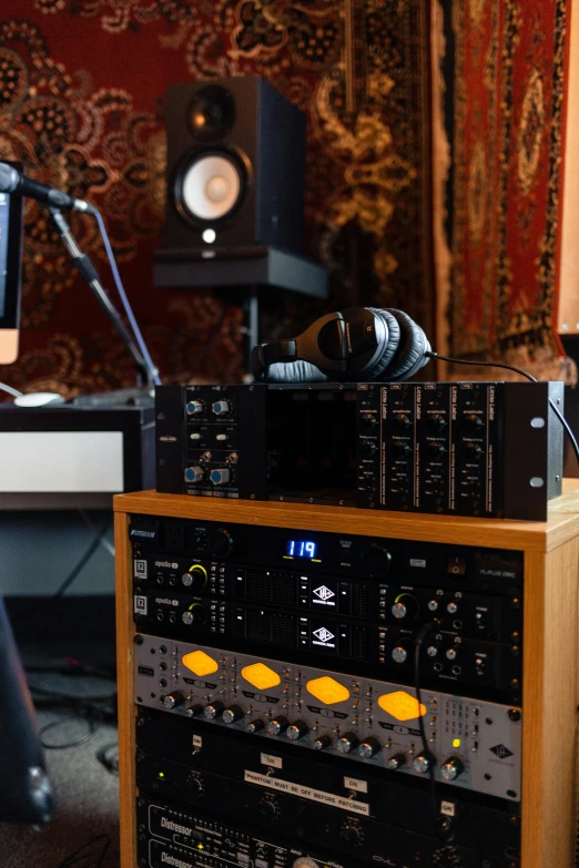 a sound studio with mixing equipment and a monitor