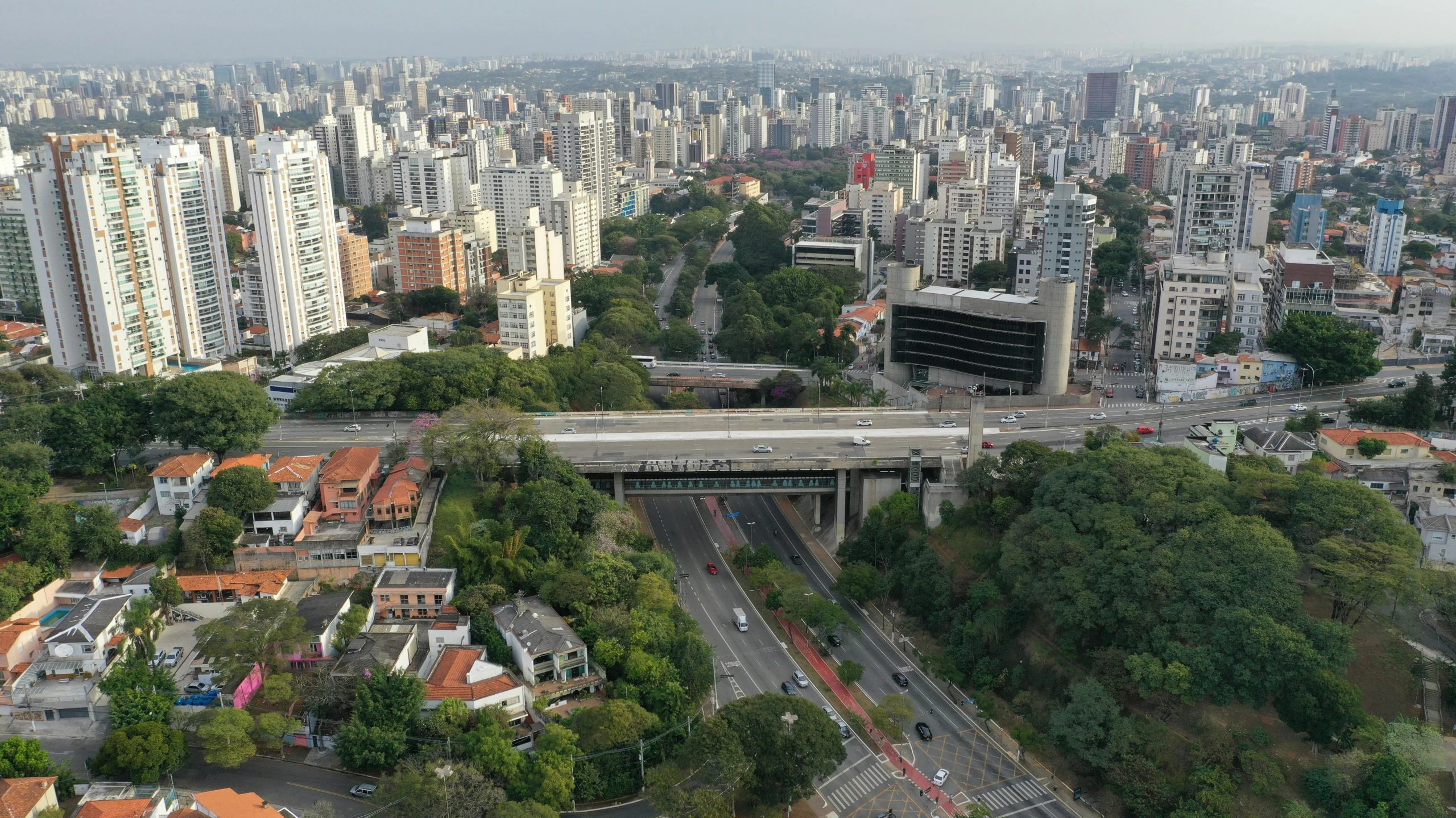 an aerial view of buildings and trees and street