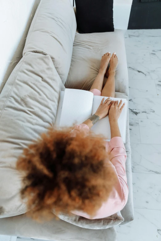 a woman lying on the floor with her feet up