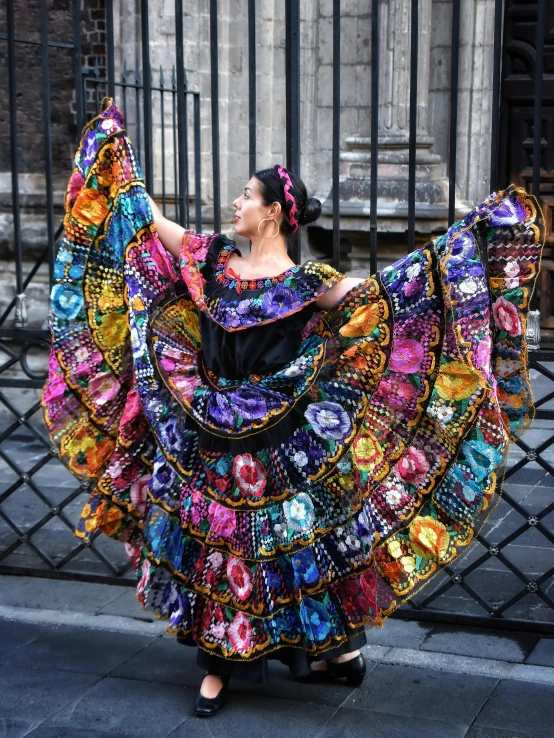 an oriental woman dances in the street