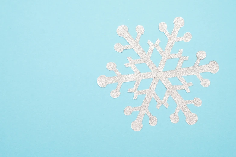 a snowflake with some white glitter on top