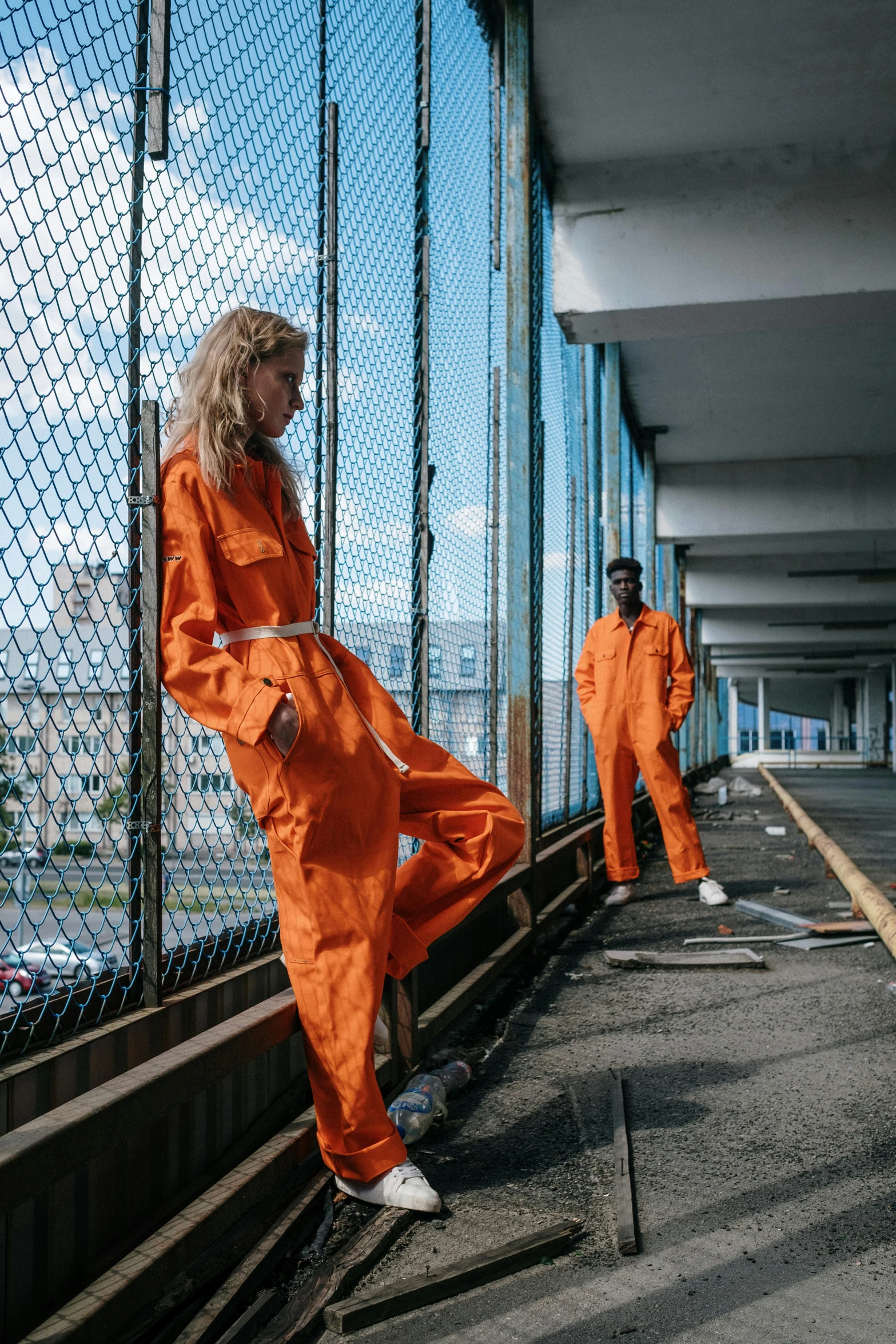 an image of two women wearing orange going into 