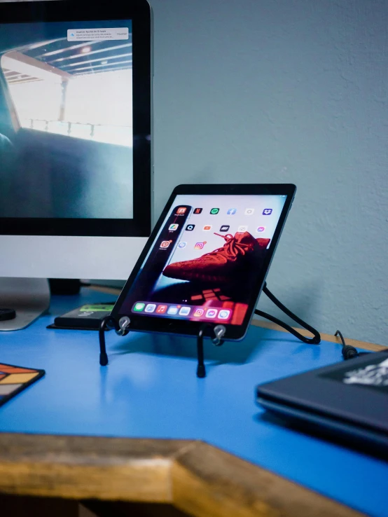 a monitor sitting on top of a blue table