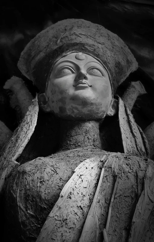 a statue is covered in water droplets and sand