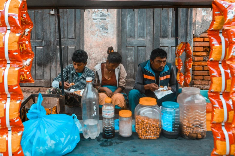 a man and woman looking at their phone