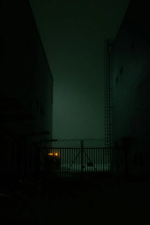 dark night scene with fire escape structure in middle