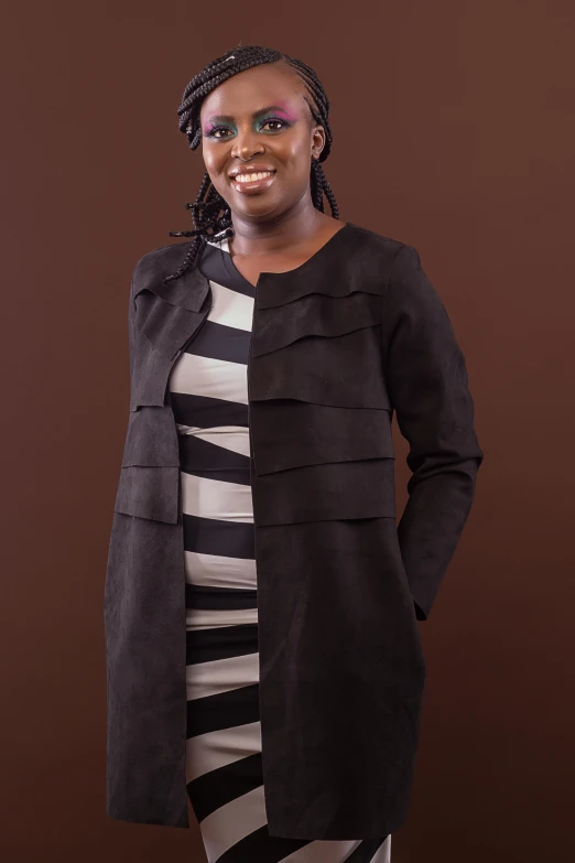 a woman wearing a black and white dress